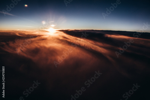 Beautiful sunset above the clouds © mehdivir