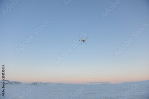 drone quadrocopter hovering in the sky