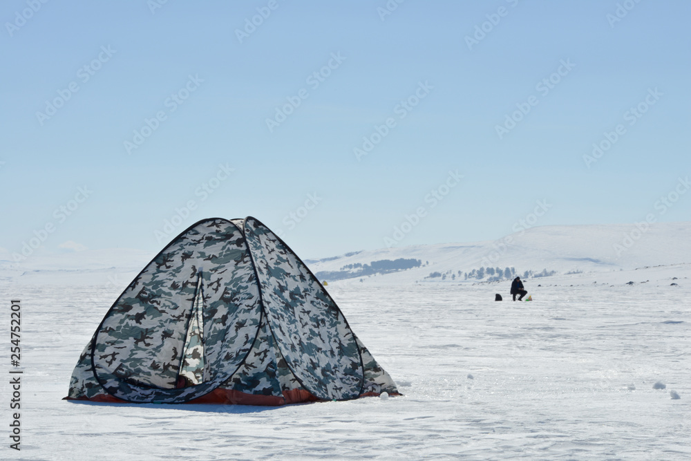 Tent for winter fishing on a frozen lake