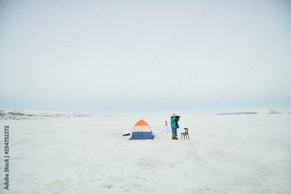 Tent for winter fishing on a frozen lake Tent for winter fishing on a frozen lake