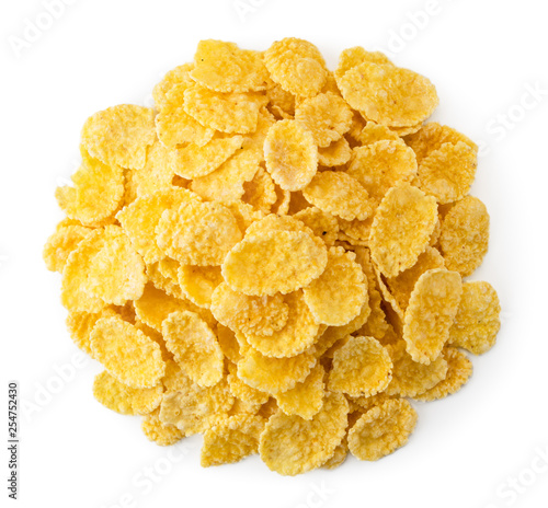 Heap of cornflakes on a white. The form of the top.