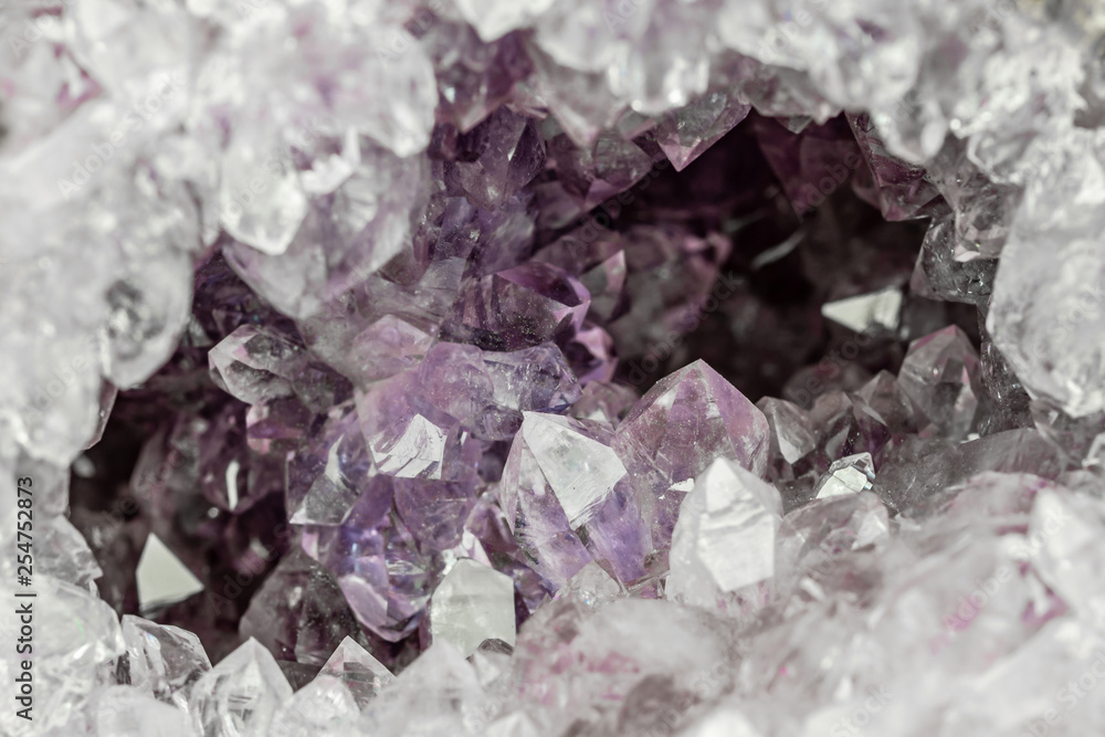 detailed view into the crystals of an amethyst geode detailed view into the crystals of an amethyst geode
