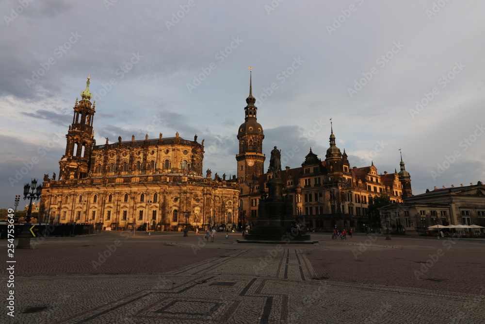 Sun lit architecture in Dresden, Germany. View of the Theater Platz and the Roman Catholic Cathedral (Katholische Hofkirche) in the background.