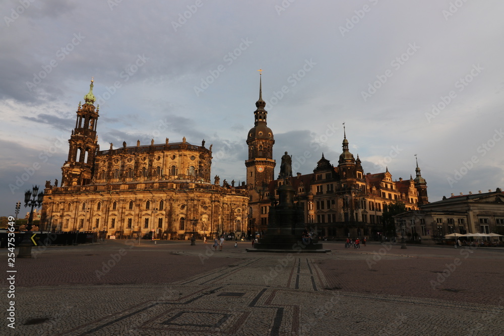 Fototapeta premium Sun lit architecture in Dresden, Germany. View of the Theater Platz and the Roman Catholic Cathedral (Katholische Hofkirche) in the background.