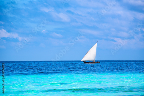 sailboat in the azure ocean