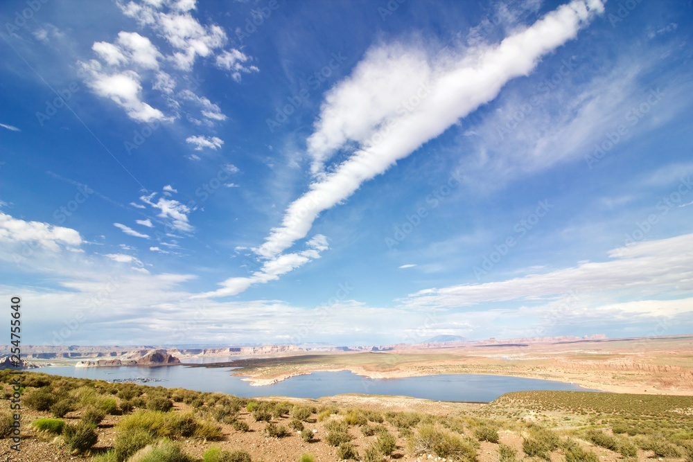 Lake in the Desert in Utah, USA. Blue sky with gigantic clouds over the canyon background.