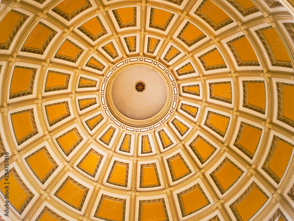 Concentric rings and yellow painted panels inside the dome of the Colorado capitol building