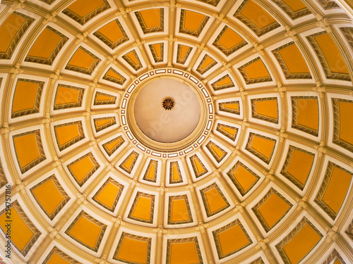 Concentric rings and yellow painted panels inside the dome of the Colorado capitol building