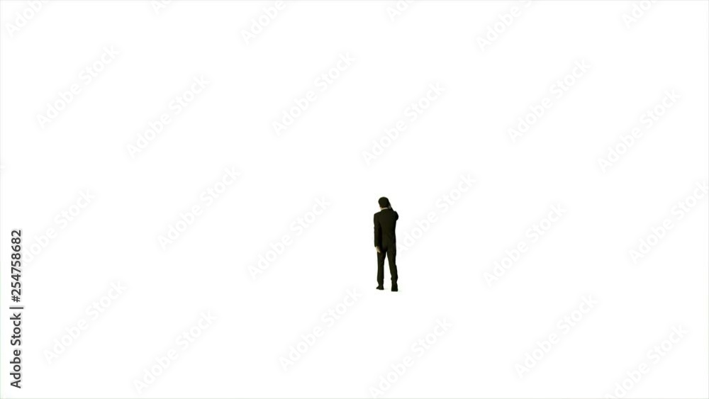 Businessman talking on mobile phone against white Businessman talking on mobile phone against white