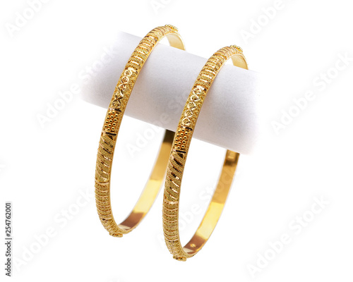 22k gold bangle on white background