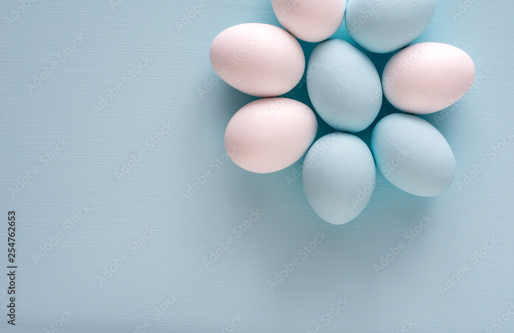 Spring and Easter holiday concept. Easter eggs painted blue and white, pastel color background. Isolated on white. Spring and Easter holiday concept. Easter eggs painted blue and white, pastel color background. Isolated on white.