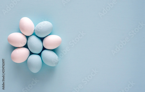 Spring and Easter holiday concept. Easter eggs painted blue and white  pastel color background. Isolated on white.