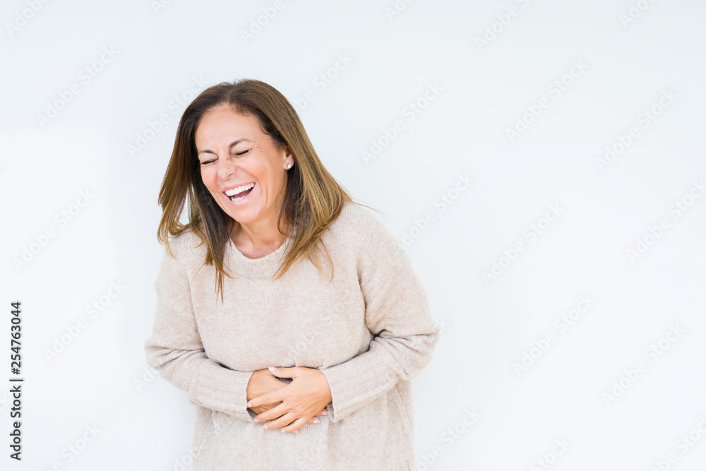 Beautiful middle age woman over isolated background Smiling and laughing hard out loud because funny crazy joke. Happy expression. Beautiful middle age woman over isolated background Smiling and laughing hard out loud because funny crazy joke. Happy expression.