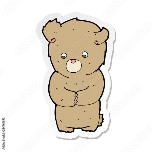 sticker of a cartoon shy teddy bear