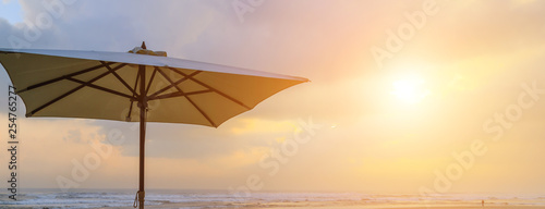 Sun of summer time on sky and umbrella