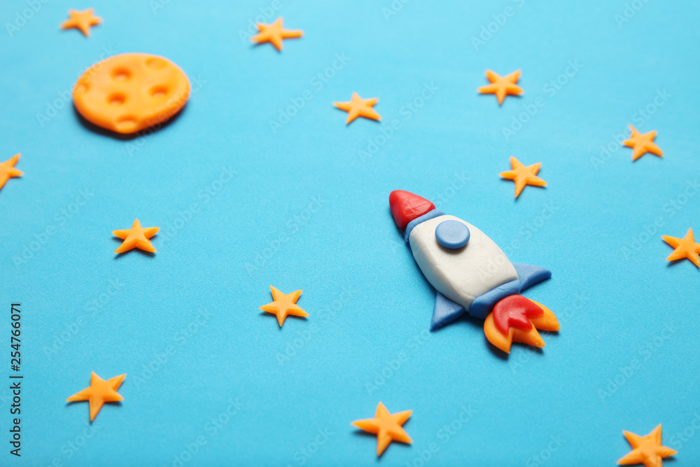 Kid (child) rocket in space, adventure and science. Stars, and moon. Plasticine art, cartoon. Kid (child) rocket in space, adventure and science. Stars, and moon. Plasticine art, cartoon.