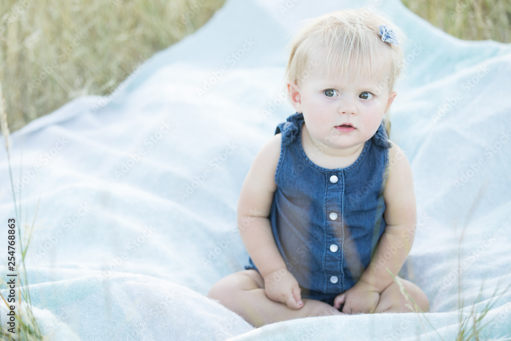 Somber little girl on blanket Somber little girl on blanket