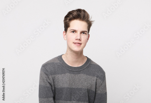 Attractive teenage boy posing in studio