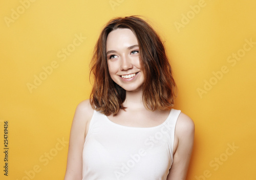 Portrait of young  positive female with cheerful expression © Raisa Kanareva