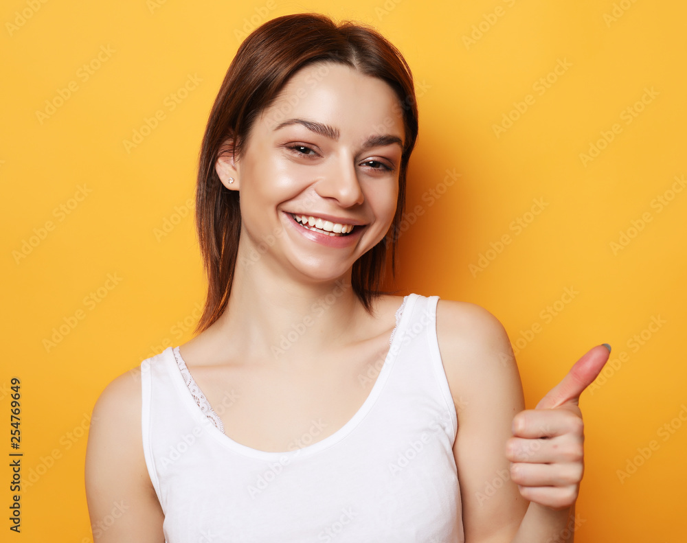 Portrait of young positive female with cheerful expression Portrait of young positive female with cheerful expression