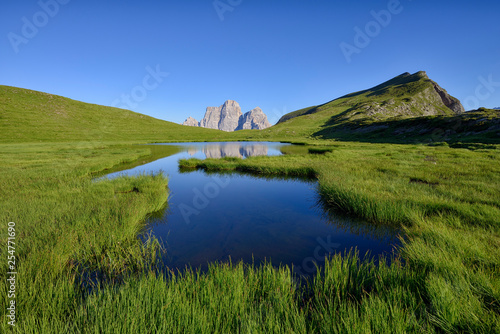 Italy, Province of Belluno, Dolomites, Selva di Cadore, Monte Pelmo reflecting in Lago delle Baste