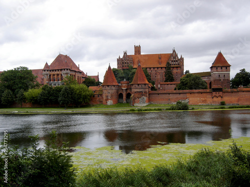 Landscape. Malbork Castle in Poland, view across the Nogat river.