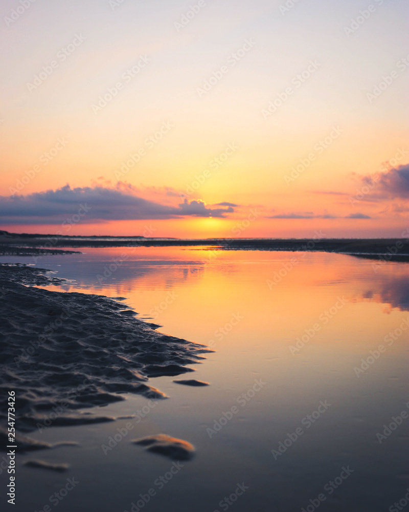 Naklejka premium sunset over beach