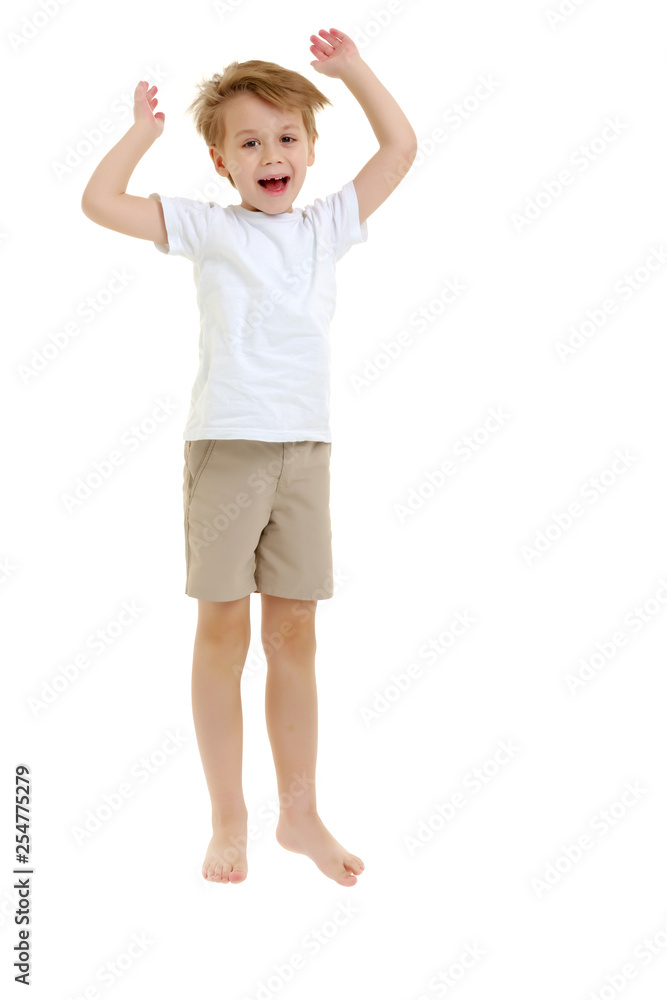 A little boy in a clean white T-shirt is jumping fun. A little boy in a clean white T-shirt is jumping fun.
