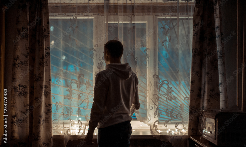 boy in front of window boy in front of window