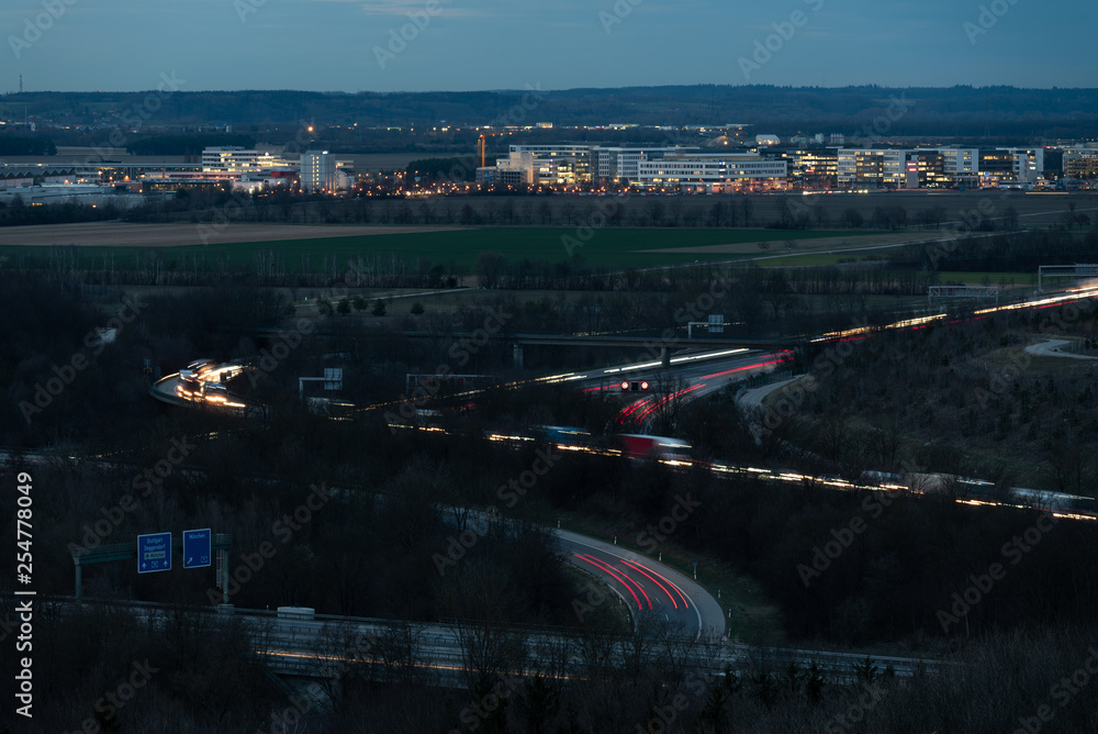 Interchange road junction traffic at night near Garching, Munich, Autobahn A9, A99.