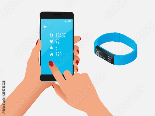 Fitness bracelet or tracker with a smartphone isolated on white. Sports accessories, a wristband with running activity steps counter and heartbeat pulse meter.