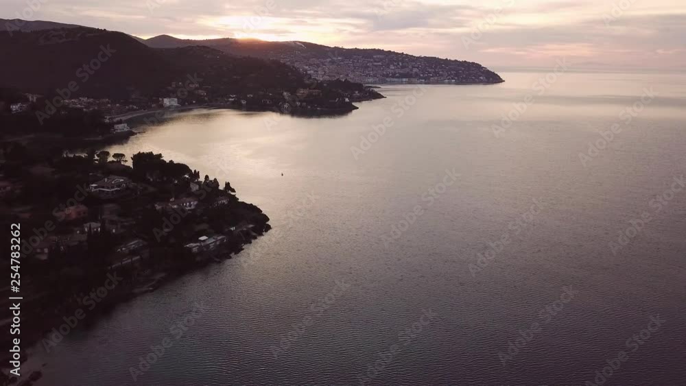 Aerial romantic view of a sunset along the sea coast of Tuscany Aerial romantic view of a sunset along the sea coast of Tuscany