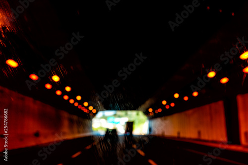 Rome, Italy day and highway road street with dark red illuminated lights tunnel on modern autostrade journey way lanes photo