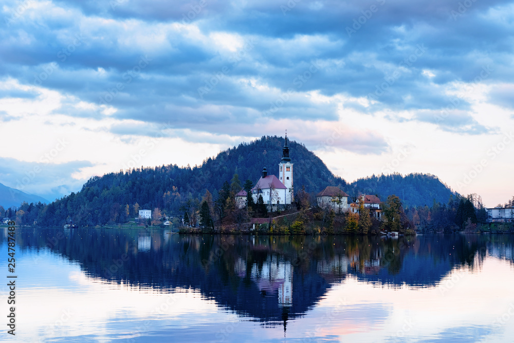 Beautiful landscape of Bled Lake and Church in Slovenia sunset