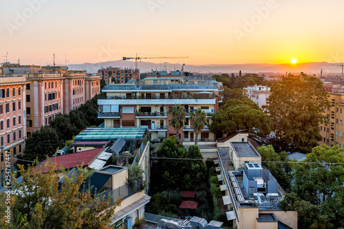 Canvas Print Cityscape of Rome, Italy historic city with construction crane in summer evening