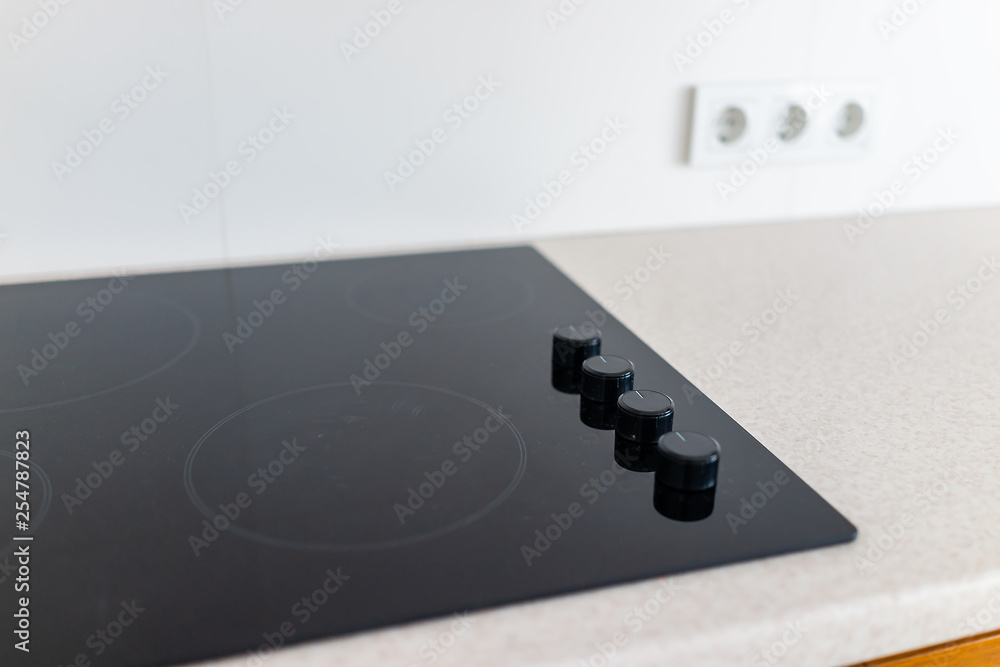 Ταπετσαρία Closeup and knobs on modern luxury electric cook stove top stovetop cooktop with