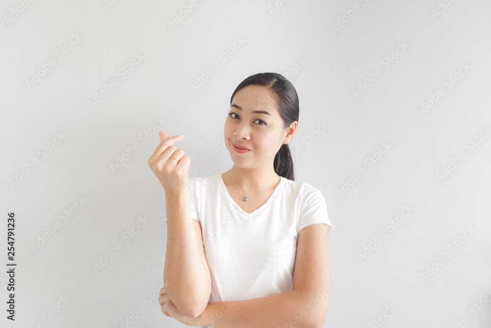 Smile and happy woman in white t-shirt. Concept of happy and thinking positive. Smile and happy woman in white t-shirt. Concept of happy and thinking positive.