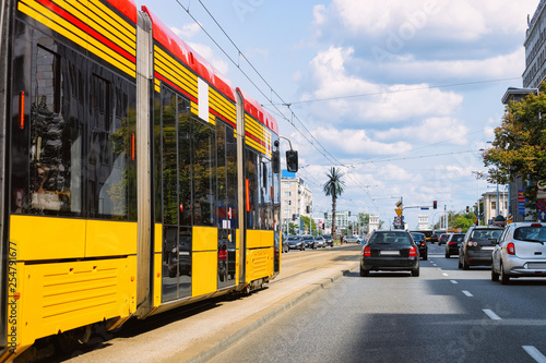 Trolley and cars in road in Warsaw city center