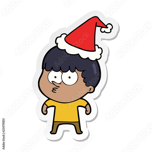 sticker cartoon of a curious boy wearing santa hat