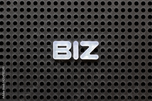 Black color pegboard with white letter in word biz (Abbreviation of business)