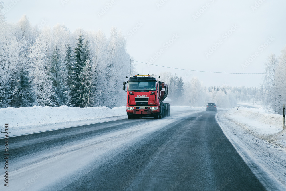 Truck on the Snowy winter Road in Finland Lapland EU