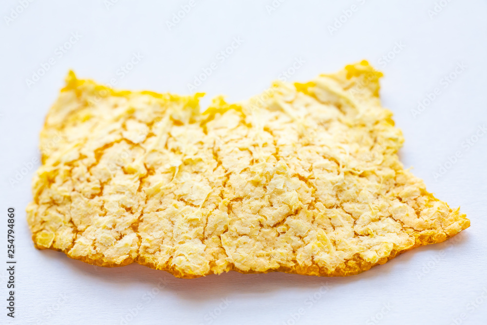 Orange fruit peel on white background, Close up and macro shot, Selective focus Orange fruit peel on white background, Close up and macro shot, Selective focus