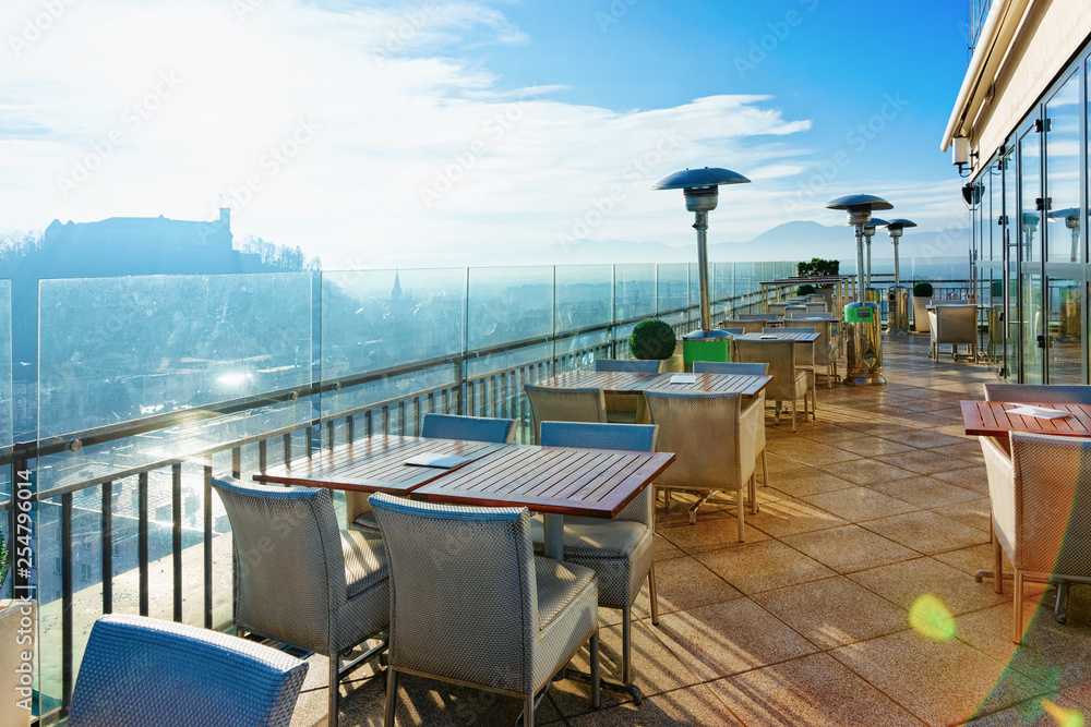 Empty street cafe with panoramic background in Ljubljana Slovenia sunrise