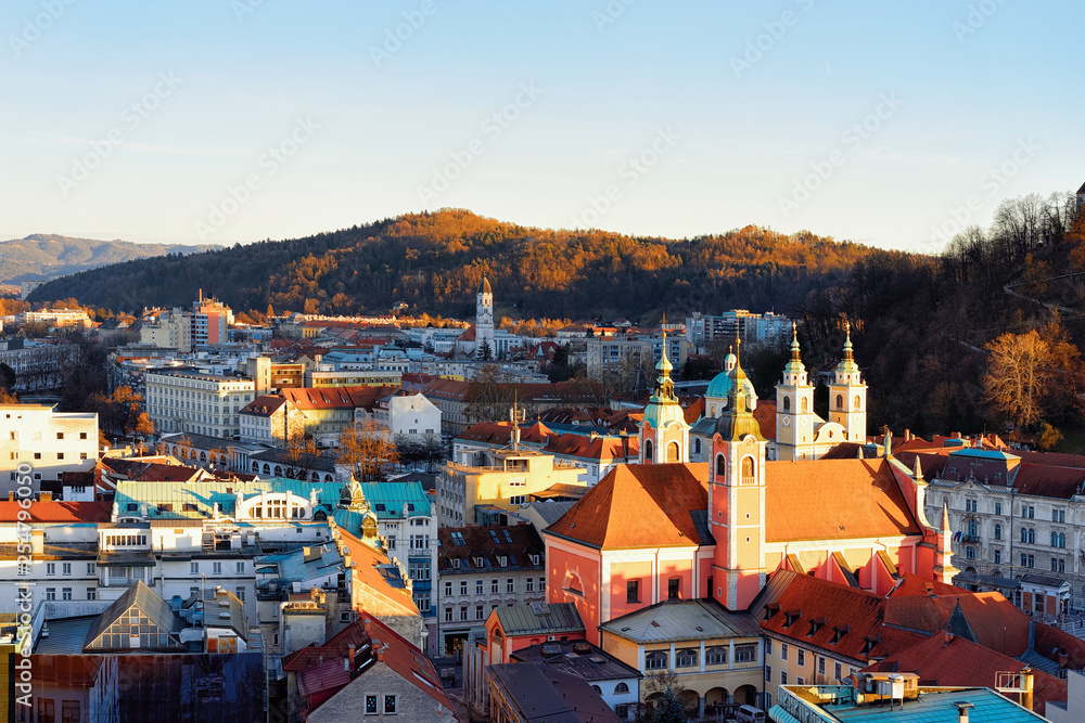 Franciscan Church and cityscape of Ljubljana old town streets evening