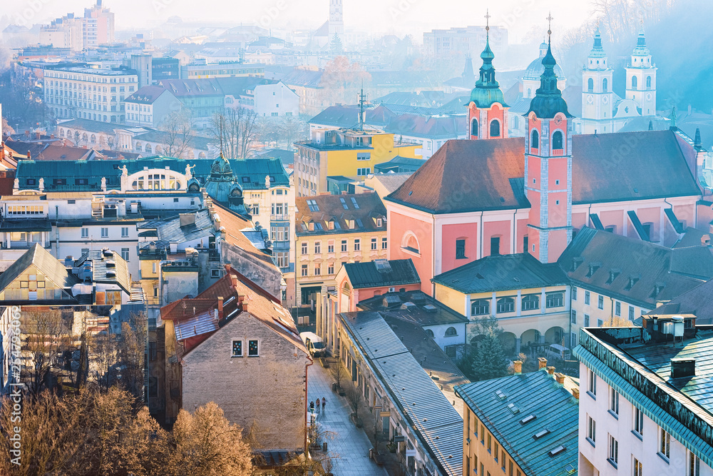 Franciscan Church and cityscape of Ljubljana old town streets morning