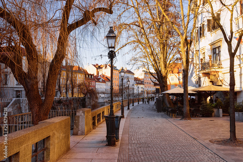 Romantic Street and cityscape of Ljubljana old town Cankarjevo nabrezje photo
