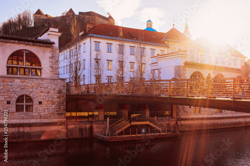 Street view with sunset in evening Ljubljana old town bridge