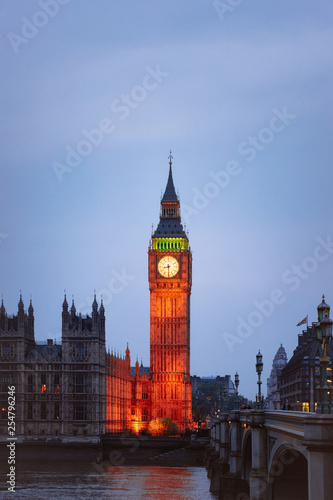 Big Ben at Westminster Palace and Thames River London evening