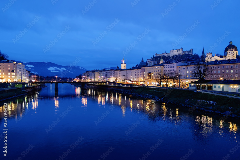 Old city Hohensalzburg castle near Salzach River Salzburg evening