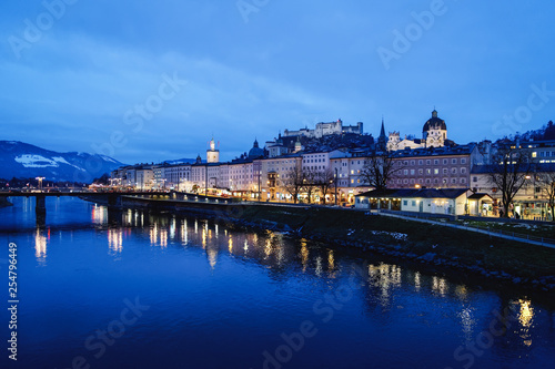 Old city and Hohensalzburg castle and Salzach River Salzburg evening